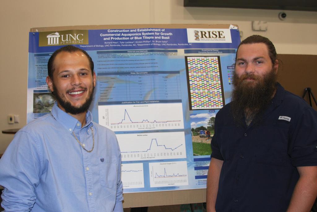 Tyler Locklear (left) and Richard Hays present their ag science research