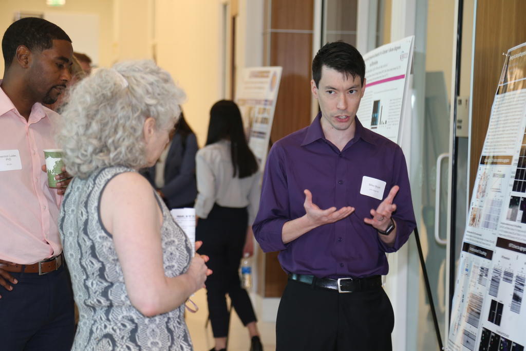 Miles Bryan III, a post-doctoral student in the Todd Cohen Lab at UNC Chapel Hill explains his research at the Duke-UNC SLAM-DUNC conference at UNC Pembroke on May 19