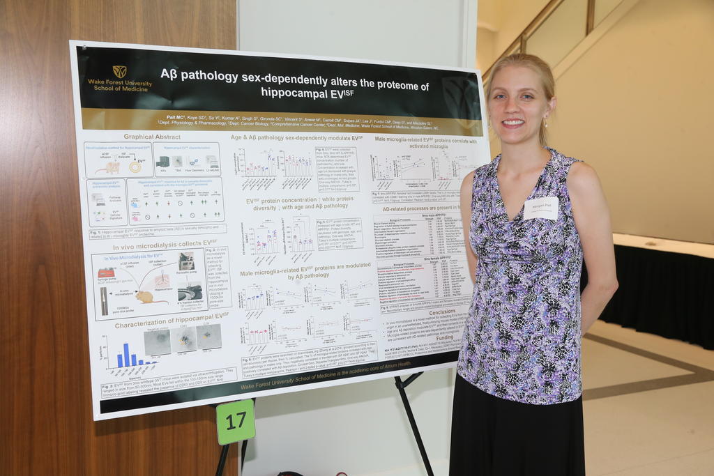 UNCP graduate Morgan Pait was among the poster presenters at SLAM-DUNC. Pait recently completed her PhD in Integrative Physiology & Pharmacology at Wake Forest University