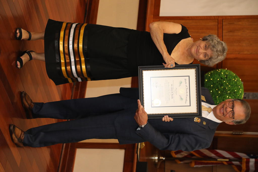 Chancellor Robin Gary Cummings (left) presents Dr. Cherry Beasley with the Order of the Long Leaf Pine