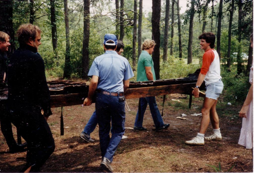 A photo taken in 1984 shows divers removing a 1,100-year-old canoe from the Lumber River