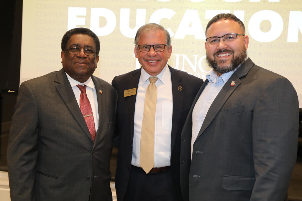 Chancellor Robin Gary Cummings, middle, with NC Rep. Garland Pierce and Jarrod Lowery