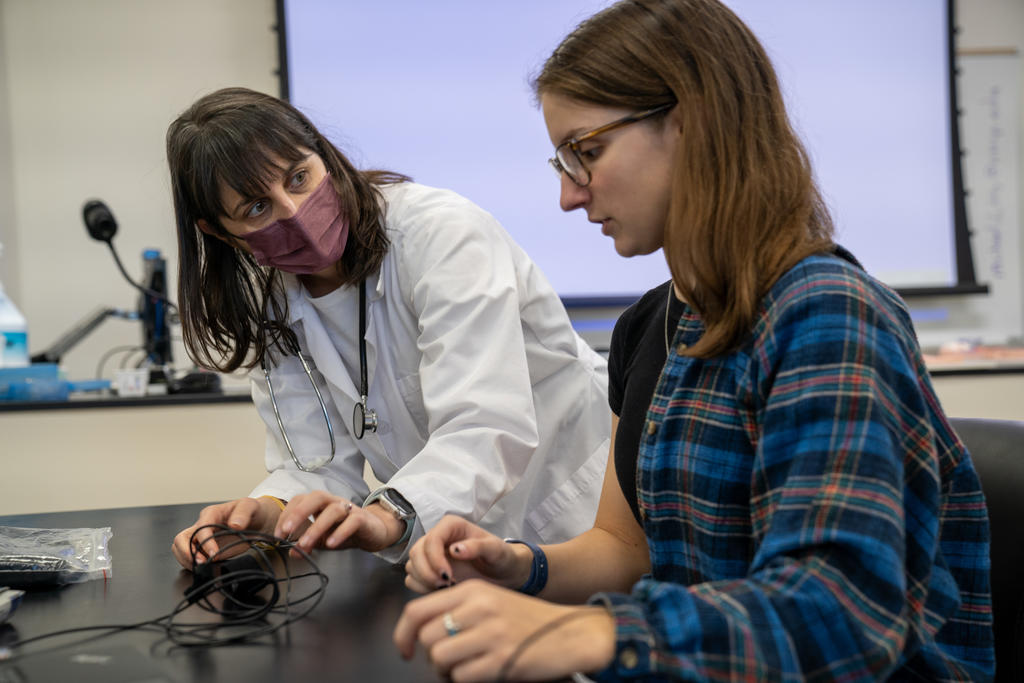 Dr. Silvia Smith (left) instructs a student