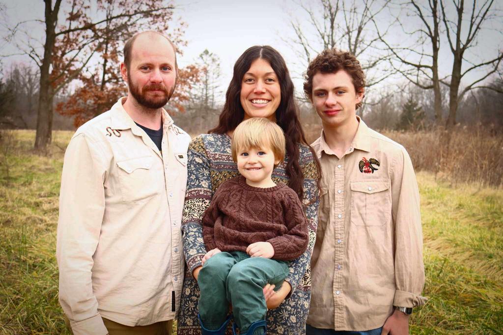 Family photo (left to right): Zachary, wife Blair (holding son Luke), and son Ethan