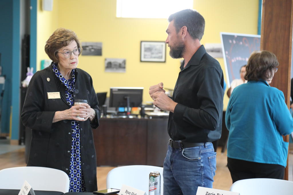 Secretary of State Elaine Marshall engages with Ryan Olufs, owner of Misty Morning Ranch in Robbins, NC