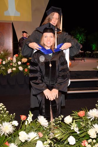 Dr. Cooper receives her doctoral hood 
