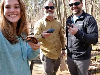 Maria Chavez, Dr. John Roe, and Kristoffer Wild find spotted turtles in the field