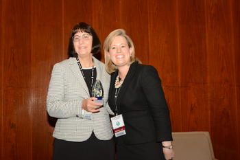 Dr. Rita Hagevik (left) receives STEM Teaching Award at Bridging the Gap Conference