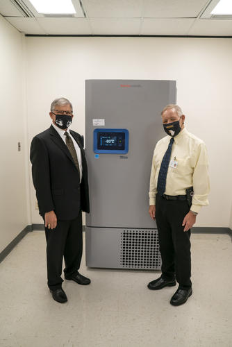 Bill Smith and Chancellor Cummings with freezer at RCHD