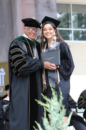 Chenoa Chavis receives her diploma from Chancellor Robin Gary Cummings on Saturday, May 14, 2022. Chavis was among 1,077 graduates to cross the stage at Spring Commencement 