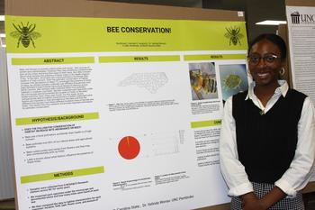 Nia Brown is shown presenting her research during the 2023 UNCP PURC symposium