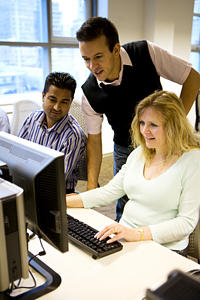 Students convened around a computer