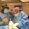 Dr. Hannah Woriax performing a procedure in the operating room at The University of Alabama at Birmingham