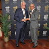 Chancellor Robin Gary Cummings presents Dr. Stewart Thomas with the 2022 Board of Governors Excellence in Teaching Award